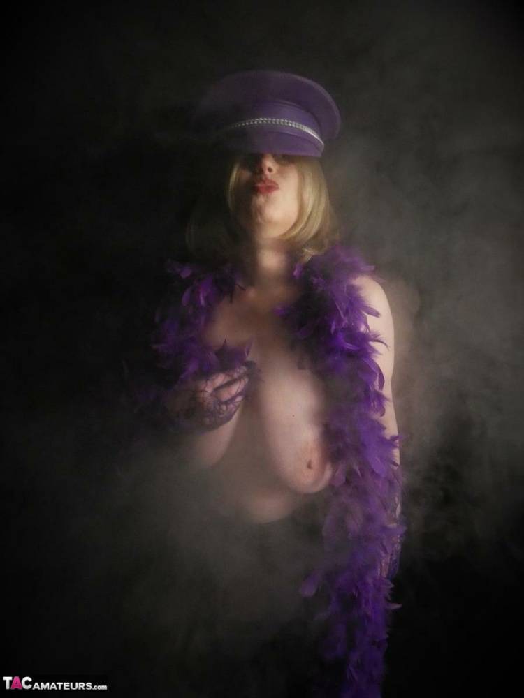 Mature woman Posh Sophia displays her huge boobs in a fetish themed hat | Photo: 1428411