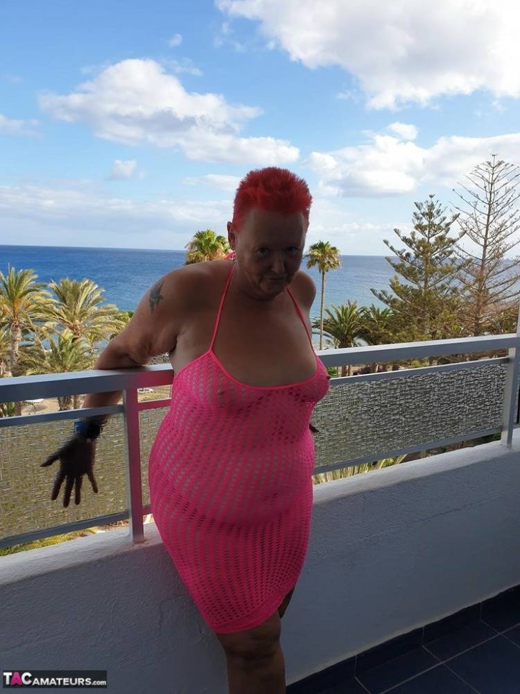Fat nan with short red hair finger spreads her pussy on oceanside balcony - #5