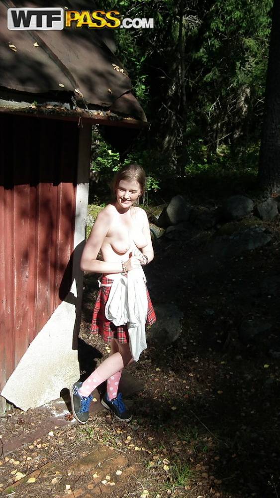 Solo girl shows her tits and twat while forcing entry into abandoned cabin - #16