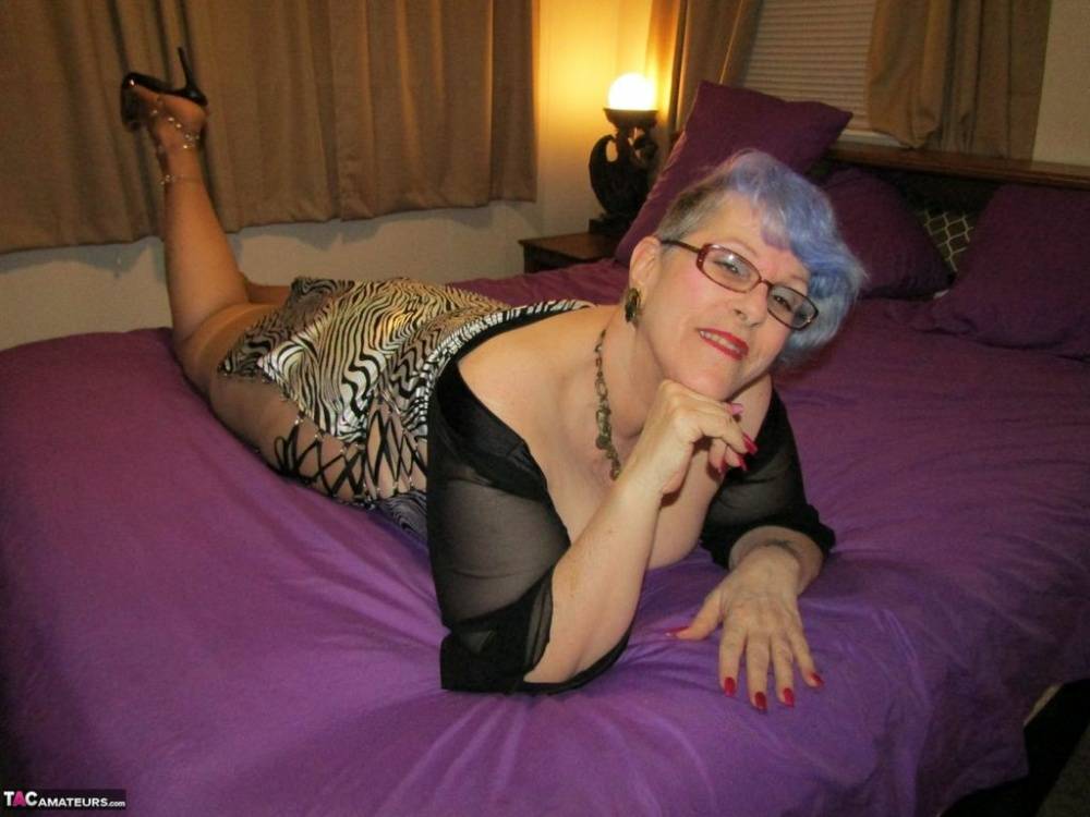 Old woman Bunny Gram shows her hose covered pussy on a bed in pointy shoes - #12
