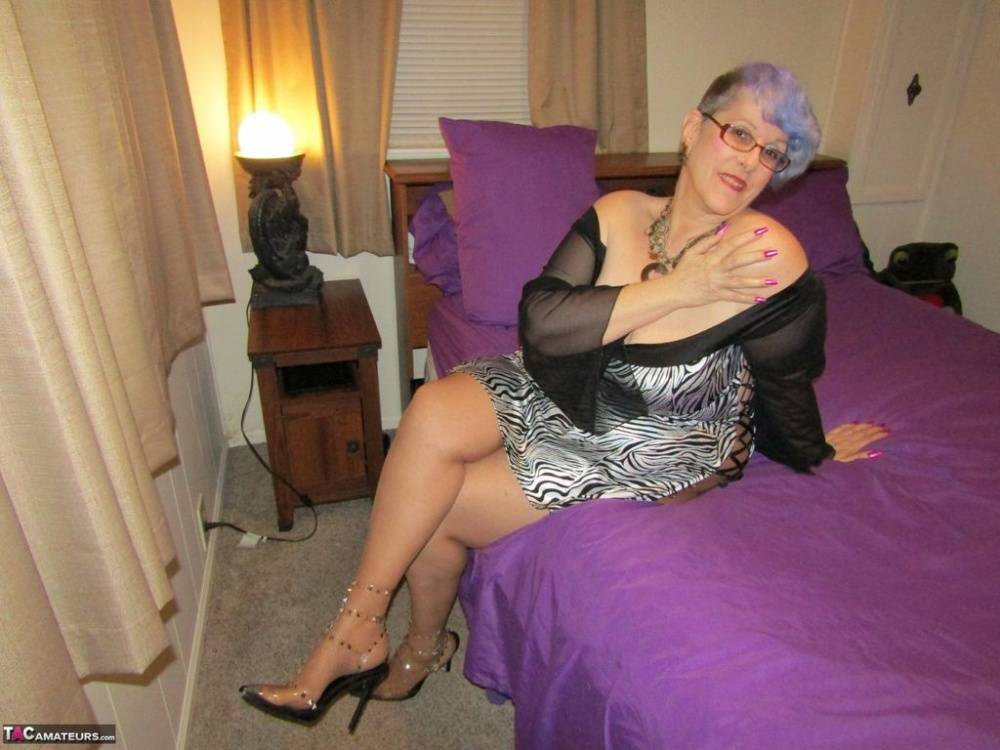 Old woman Bunny Gram shows her hose covered pussy on a bed in pointy shoes - #10