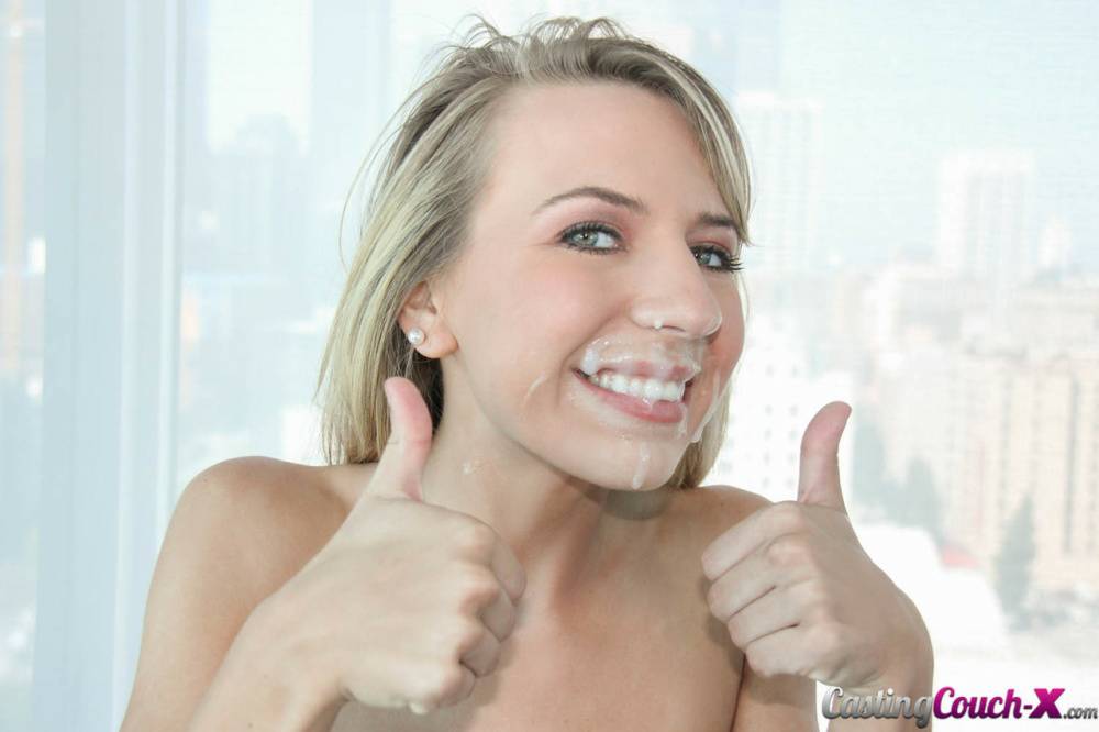 Young blonde girl gives the thumbs up with cum on face after casting couch sex | Photo: 1453815