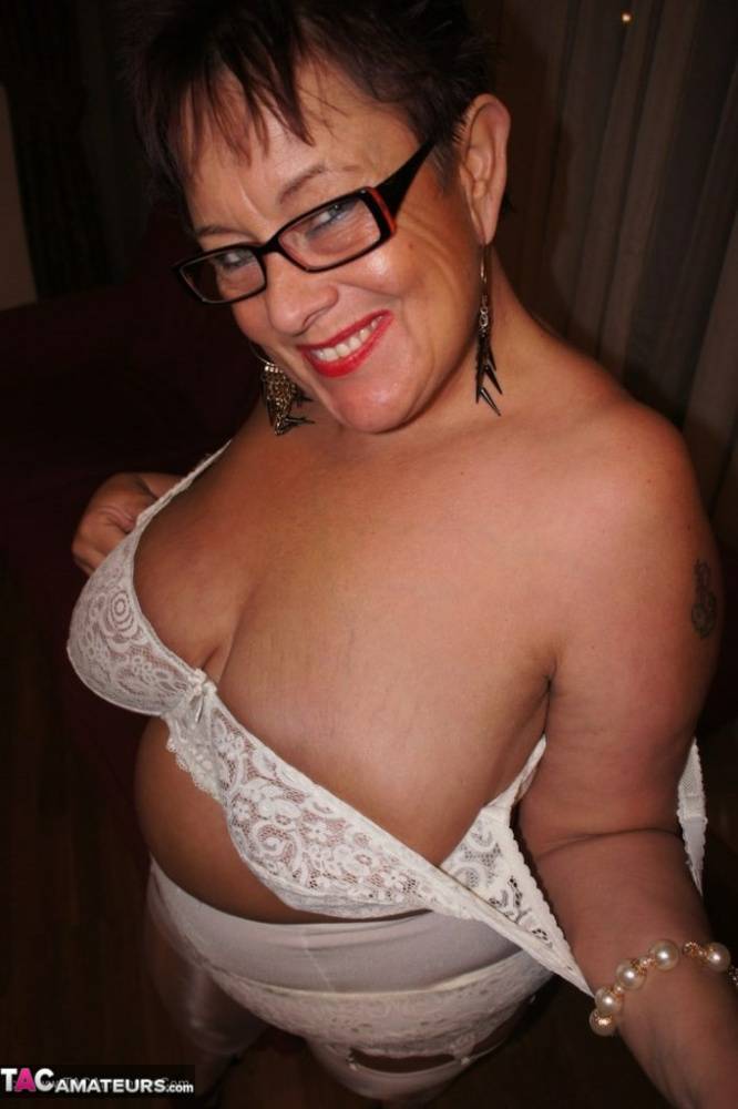 Older BBW Warm Sweet Honey sets her large tits free in hose and girdle panties | Photo: 1455725