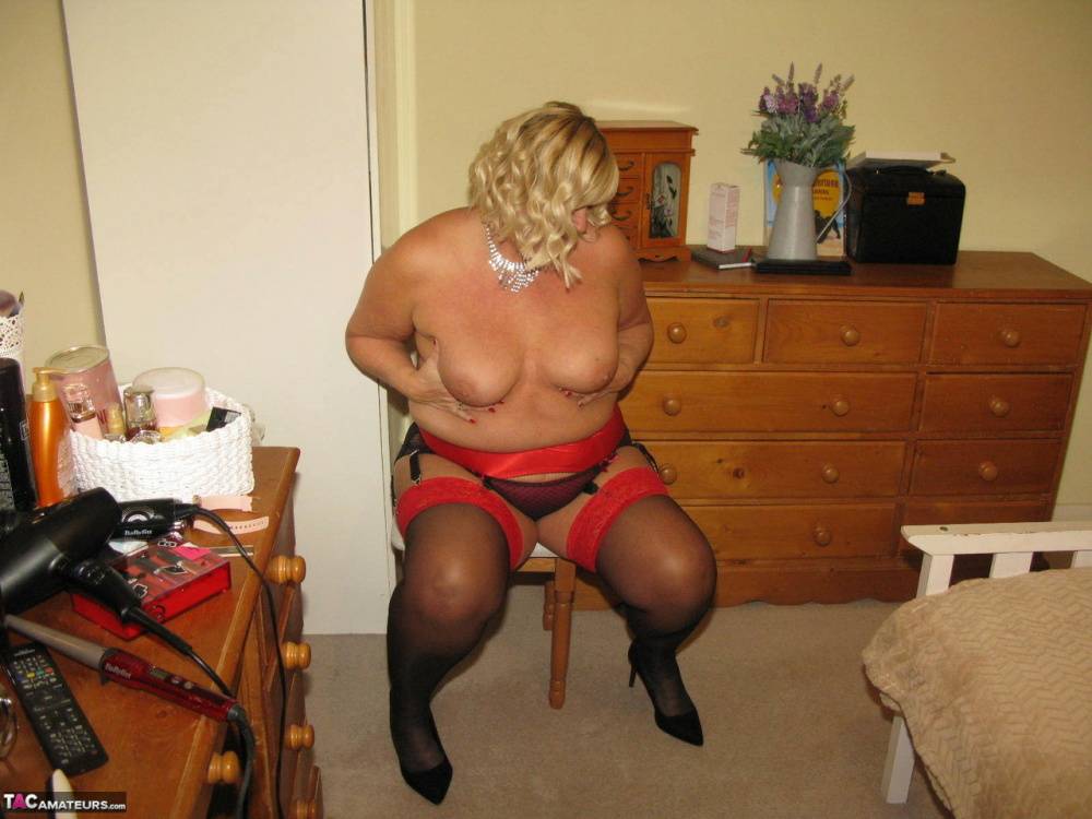 Older blonde fatty Chrissy Uk parts her labia lips on a chair in her bedroom - #9