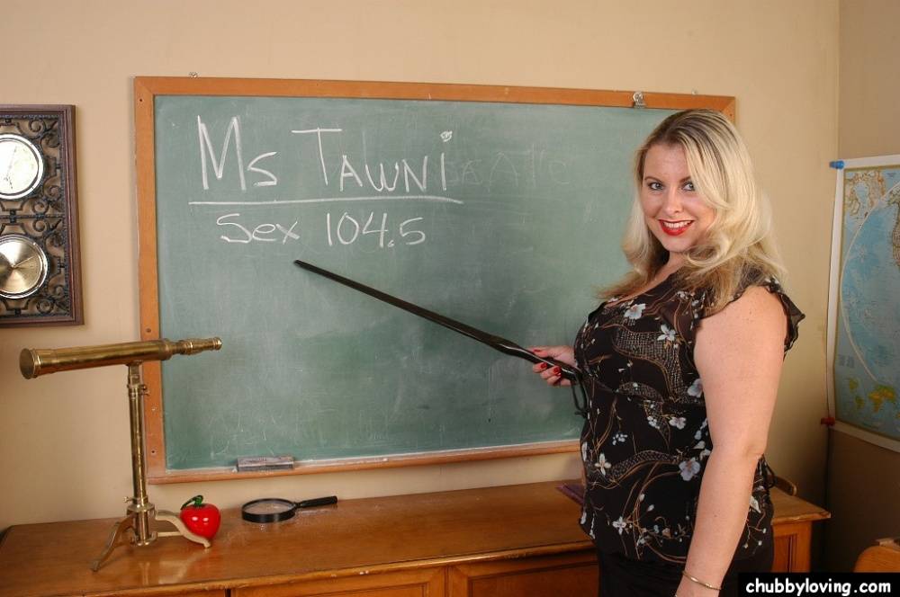 Busty blonde teacher Tawni undressing in classroom to expose bald cunt | Photo: 1482029