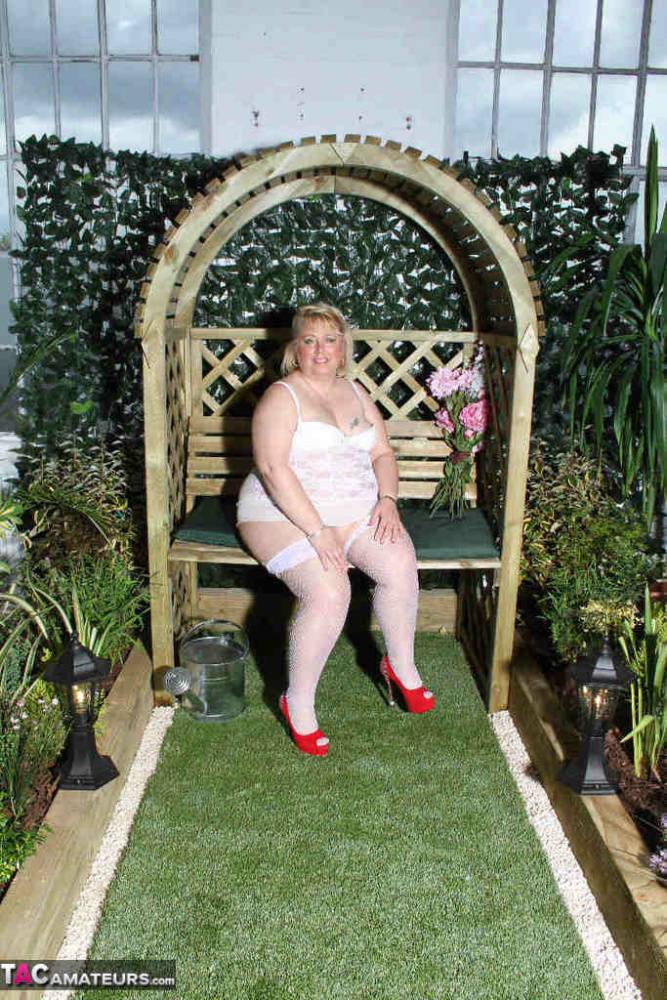 Fat blonde Lexie Cummings dildos her pierced pussy in a garden setting - #15