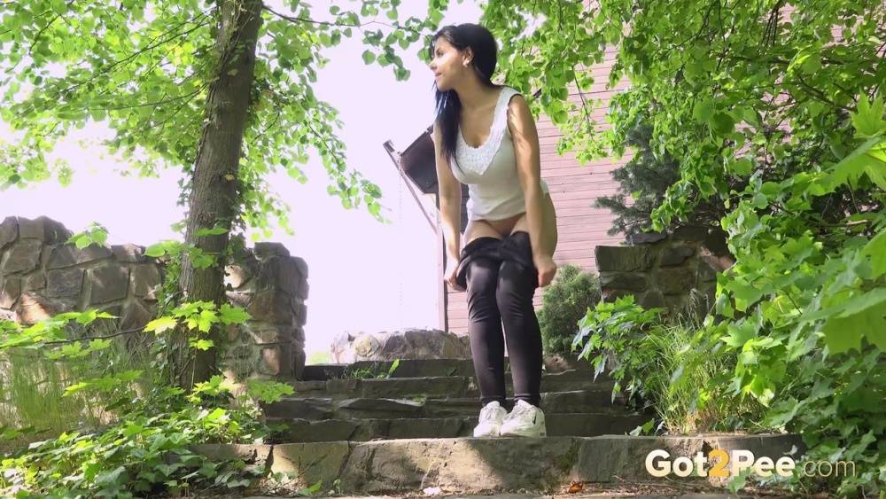 Latina female Alex Black pulls down her yoga pants for an urgent pee on steps - #8