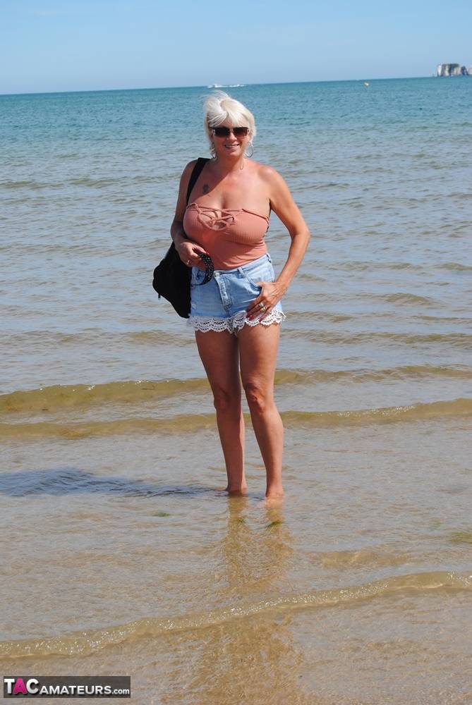Mature granny Dimonty skinny dipping at the beach with big saggy tits hanging | Photo: 1503071