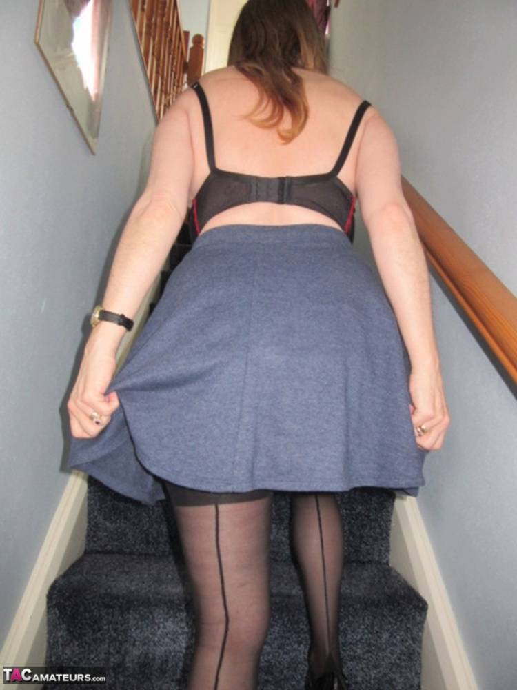 Mature woman slides panties aside after upskirt flashing on stairs - #12