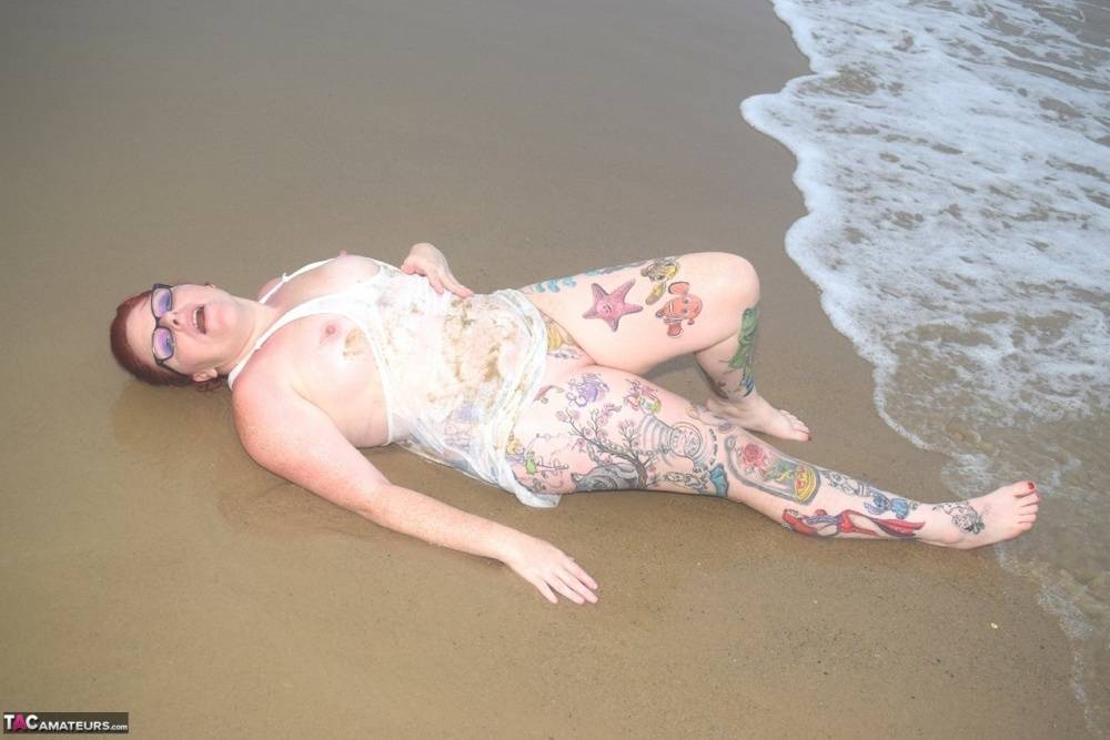 Tattooed redhead wades into the ocean before exposing herself - #4
