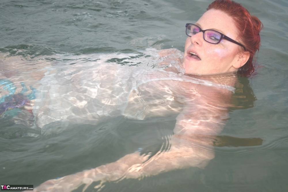 Tattooed redhead wades into the ocean before exposing herself - #6