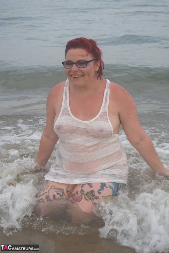 Tattooed redhead wades into the ocean before exposing herself - #16