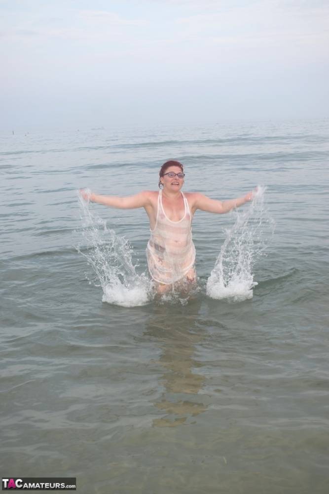 Tattooed redhead wades into the ocean before exposing herself - #3