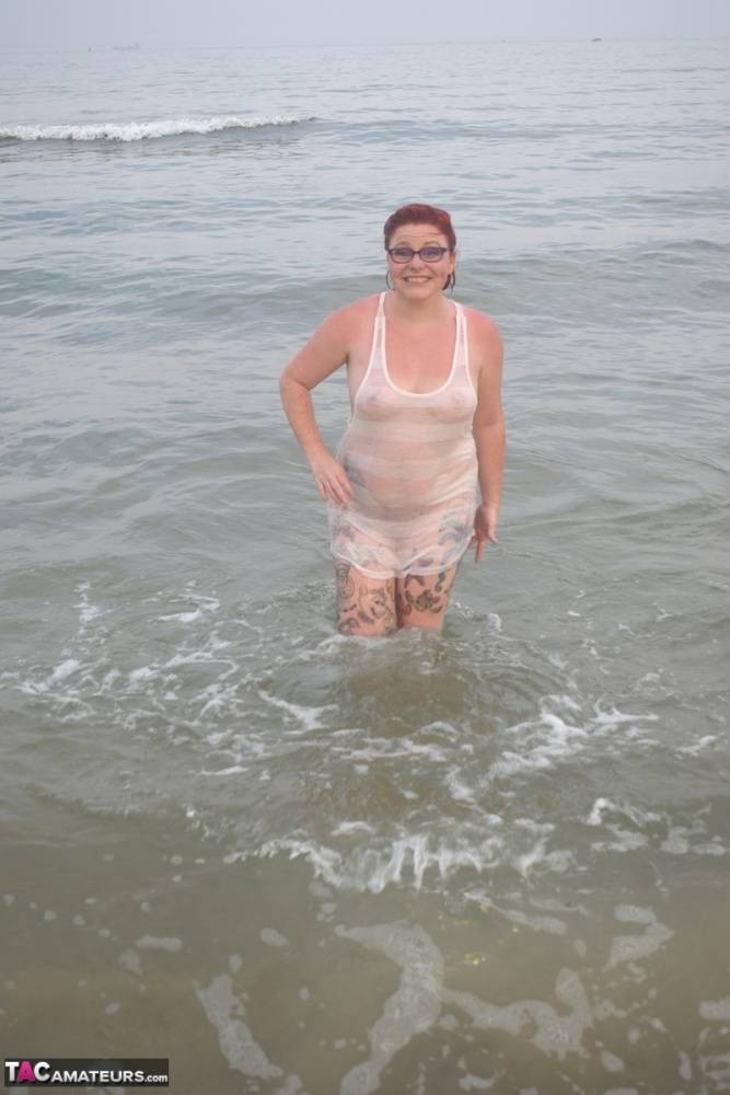 Tattooed redhead wades into the ocean before exposing herself - #10