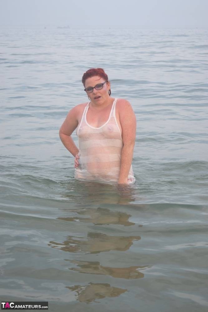Tattooed redhead wades into the ocean before exposing herself - #14
