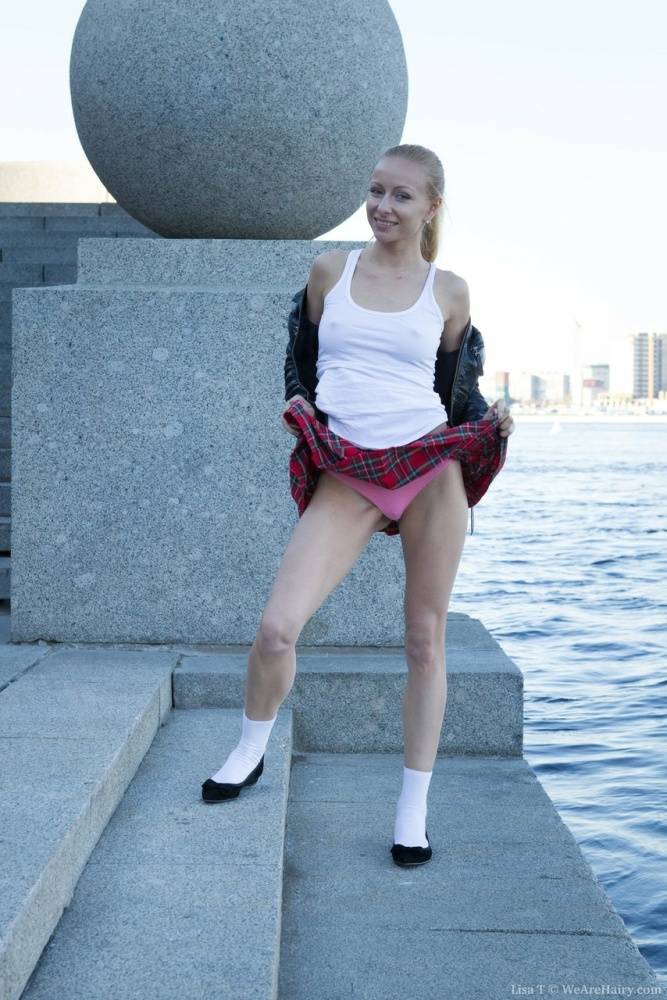 Young blonde girl Lisa T takes off her upskirt panties by the harbour | Photo: 1557086