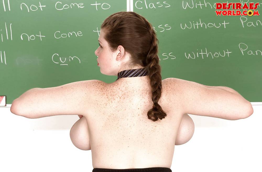 Solo girl Desirae freeing big pornstar tits from schoolgirl uniform - #5