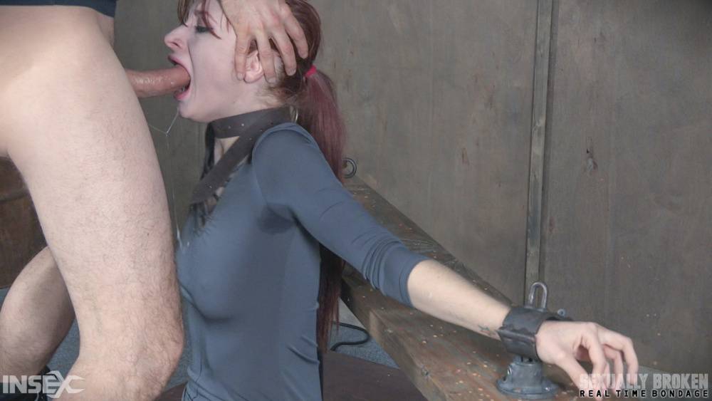 Pale redhead Violet Monroe undergoes a rough throat fucking in dungeon | Photo: 1567405
