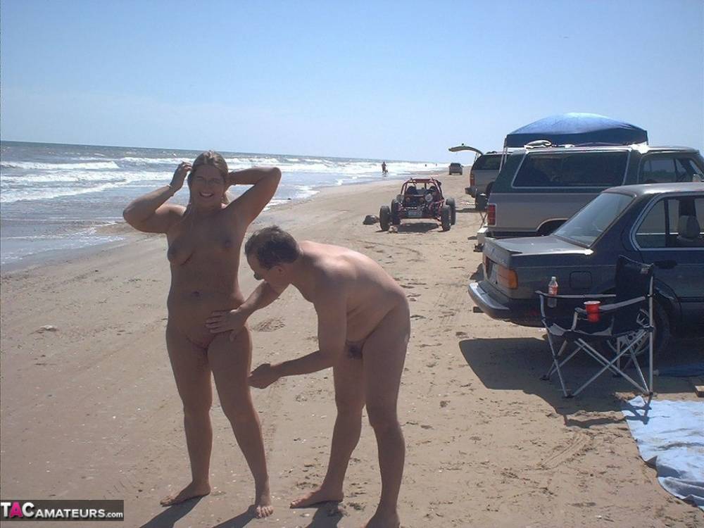 Glasses wearing amateur BBW gets gangbanged on a nude beach | Photo: 1600447