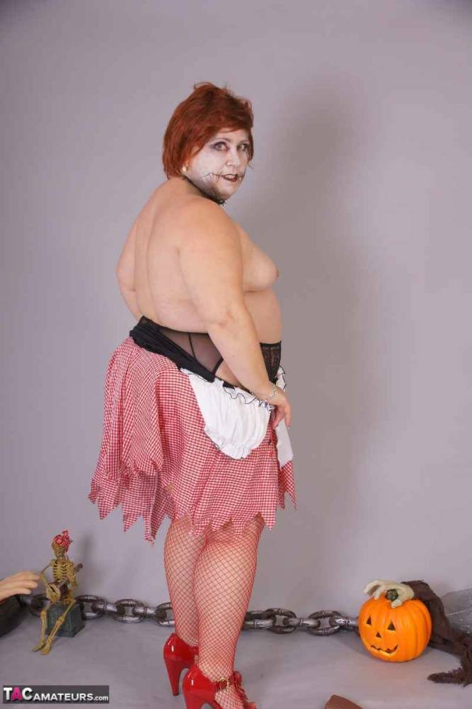 Redheaded BBW Lexie Cummings doffs cosplay wear to pose nude in mesh nylons - #7