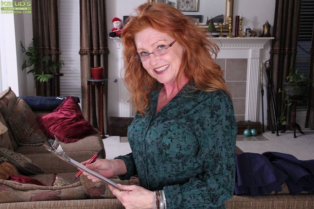 Redhead mature gal in glasses annd stockings undressing and exposing her goods - #11