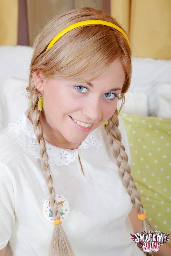 Lindsey sits on the bed in her schoolgirl outfit with her hair in braided - #12