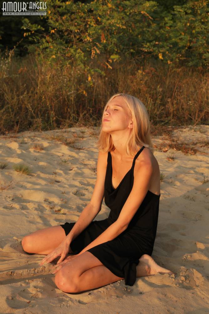 Skinny blonde teen Nora doffs a little black dress to get naked outdoors - #5