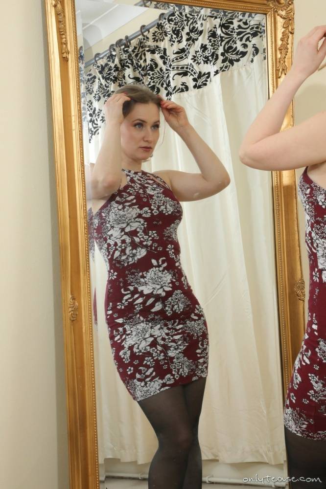 Solo girl Luna goes topless in front of a mirror in garters and nylons - #11