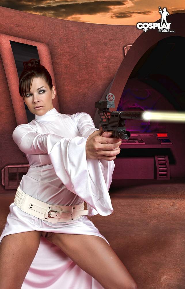 Sexy brunette wields a pistol while removing Space Princess attire - #5