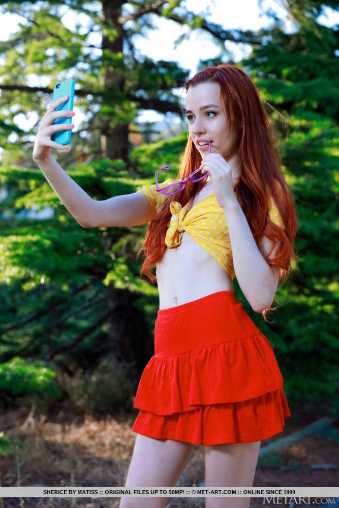 Young redhead Sherice gets totally naked after taking selfies on a forest path - #11