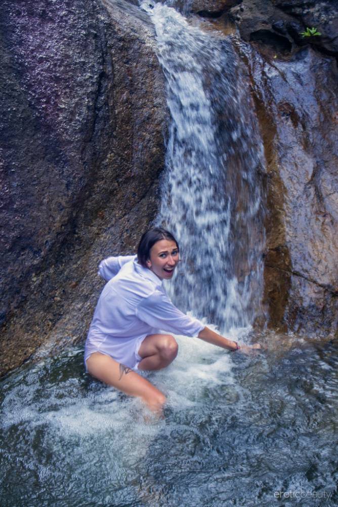 Beautiful teen Alisa M models naked in a pool below a waterfall - #7