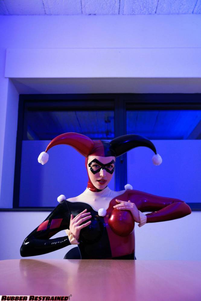 Solo model Harley Quinn poses for a non nude shoot in a costume made of latex - #10