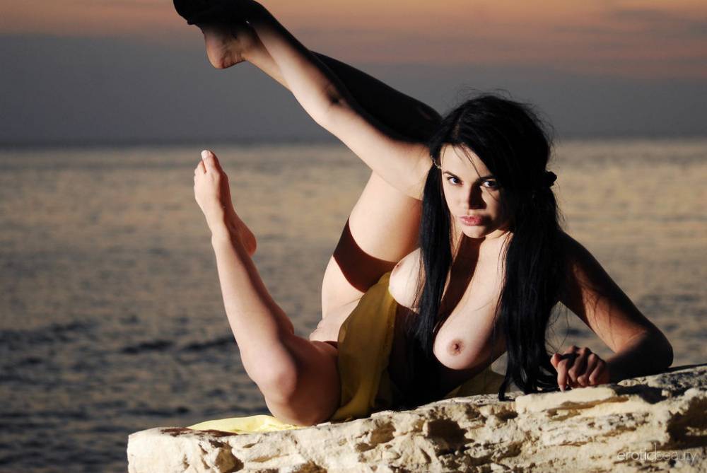 Dark haired girl Janet B sports long pigtails while naked by the sea at night - #12