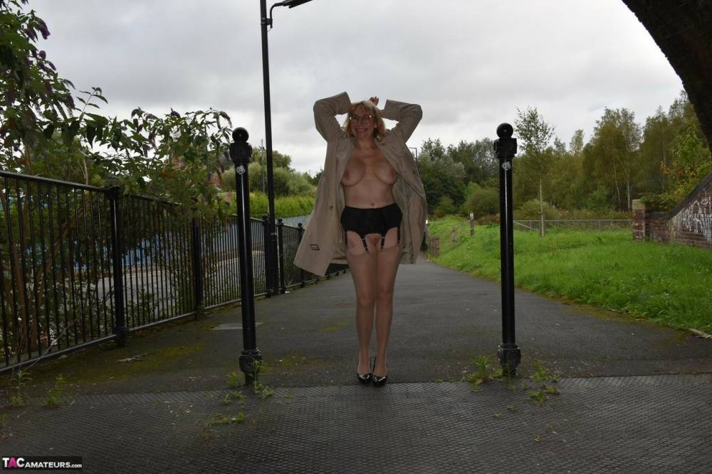 Older amateur Barby Slut flashes in a trenchcoat while out in public places - #14