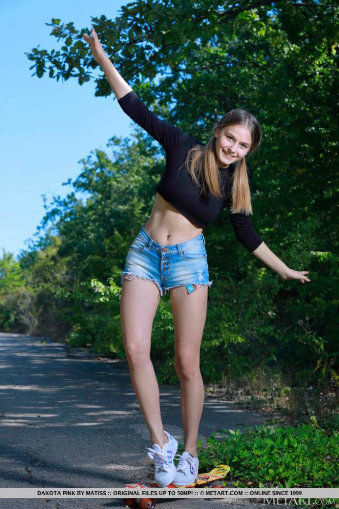 Teen solo girl Dakota Pink bares her heavenly body on a paved road - #14