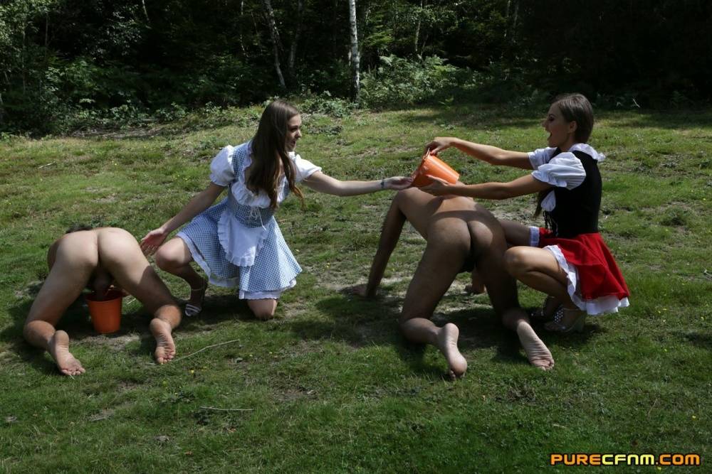 Horny femdom girls in costume head to the field to milk their naked man slave - #13