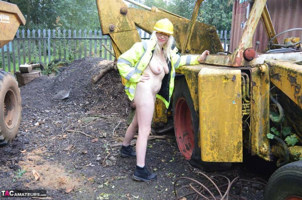 Mature amateur Barby Slut exposes herself on heavy equipment at a job site - #7