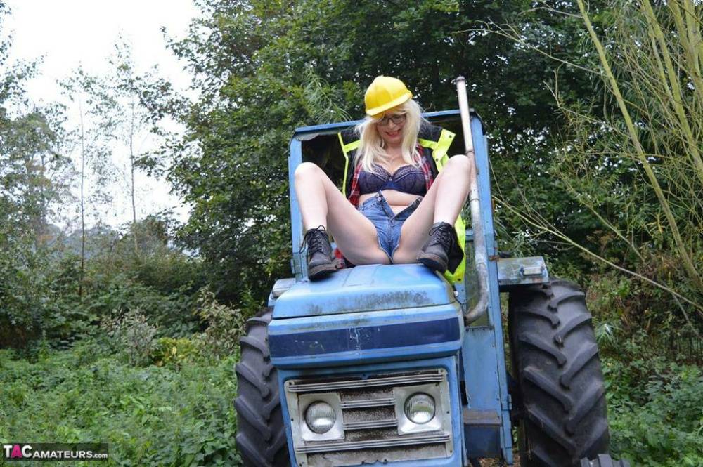Mature amateur Barby Slut exposes herself on heavy equipment at a job site - #8