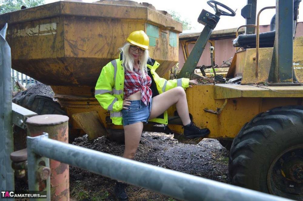 Mature amateur Barby Slut exposes herself on heavy equipment at a job site - #9