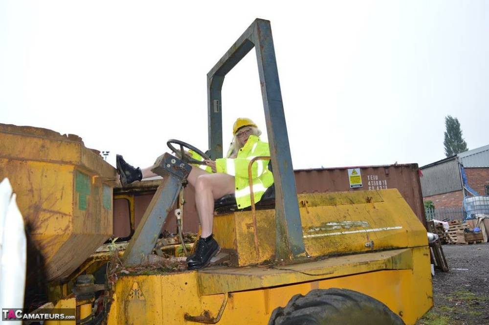Mature amateur Barby Slut exposes herself on heavy equipment at a job site - #3