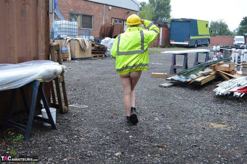 Mature amateur Barby Slut exposes herself on heavy equipment at a job site - #13