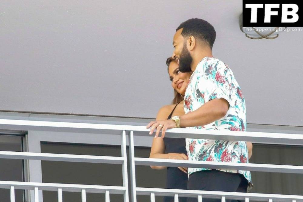 Chrissy Teigen & John Legend Kiss and Pose During an Impromptu Balcony Shoot - #11