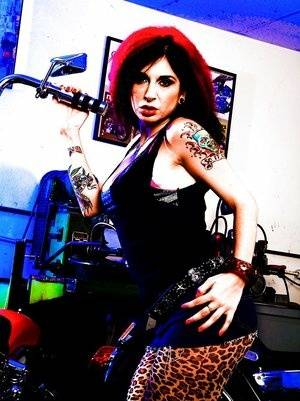 Tattooed amateur babe Joanna Angel reveals her milf ass on a bike - #main