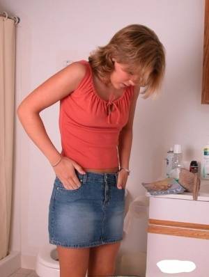 Amateur girl Karen hikes her denim skirt in the bathroom to expose her panties - #main