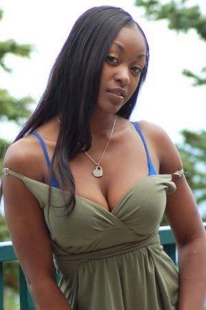 Ebony amateur Amber releases her big tits from a long dress on a balcony - #main
