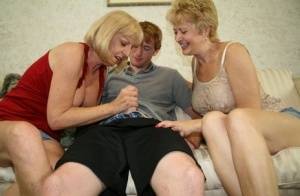Two blonde grannies share a horny student's hard white dick on the sofa - #main