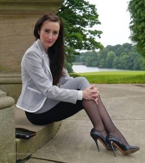 Clothed woman Sophia descends park steps in a long skirt and stiletto heels - #main