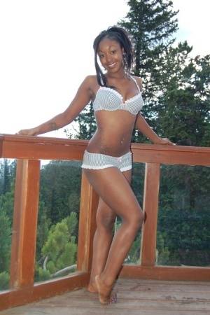 Black girl Amber uncups her big tits while getting in an outdoor hot tub - #main