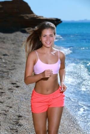 Fit young girl Mary Rock gets completely naked on a beach after exercising - #main