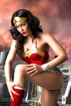 Beautiful brunette peels off her Wonder Woman outfit in a tempting manner | Photo: 113771